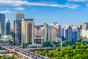 Beijing, Shanghai ease more curbs