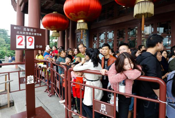 China's tourist hotspots lift reservation requirements amid surge in visitors